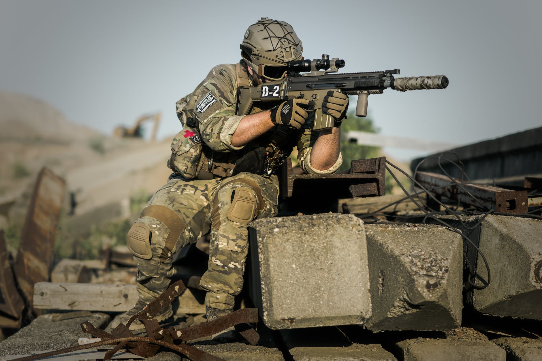 A Soldier looking through the scope of his rifle