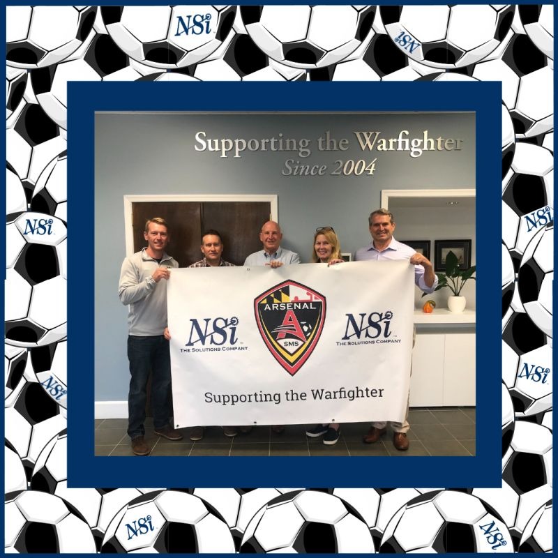 NSI Leadership holding a banner